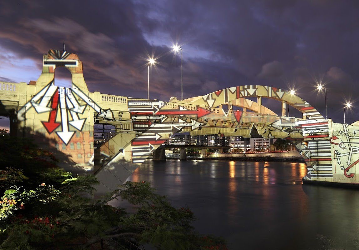 An image of William Jolly Bridge, with projections of red, white and black arrows